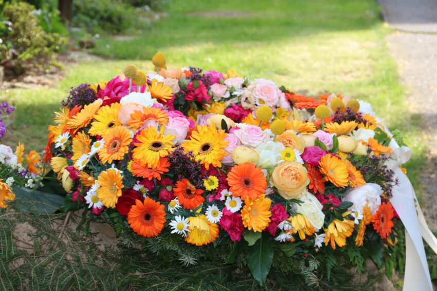 Mourning,Wreath,With,Colorful,Flowers,After,A,Funeral