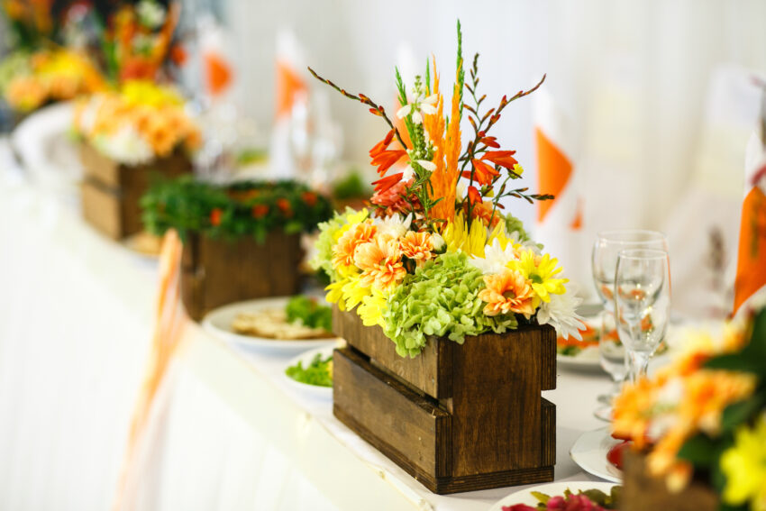 Stunning,Unusual,Decorated,Centerpiece,Table,With,Orange,And,Yellow,Flowers